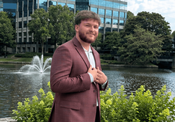 A Revamped Marketing team member outside near a fountain